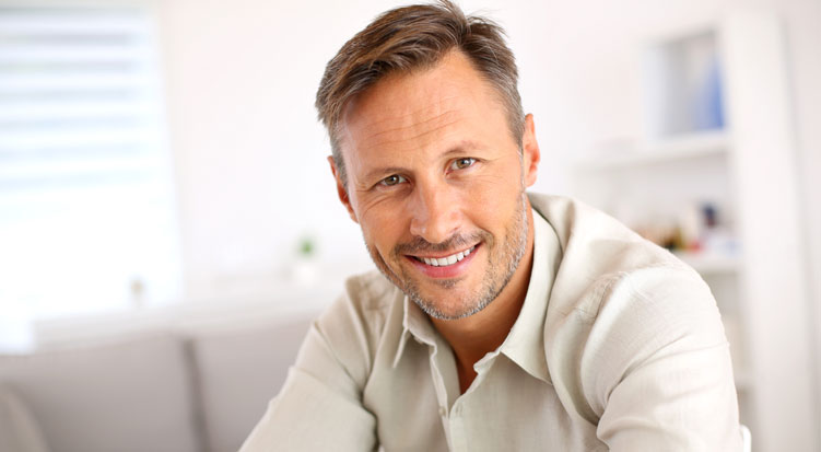 Stock image of a smiling man with nice teeth.