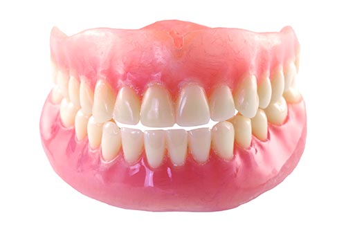 Stock image of a set of traditional dentures.