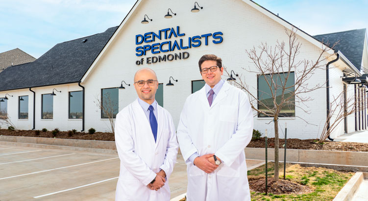 Dr. Koticha and Dr. Al Sakka standing in front of the Dental Specialists of Edmond dental office.