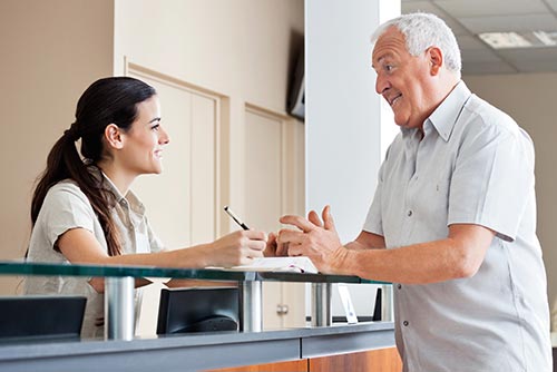 receptionist greeting patient